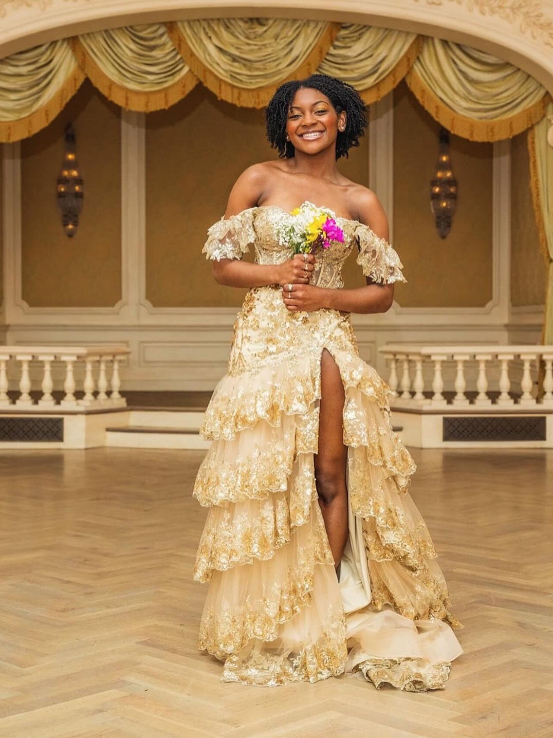 Photo of the real bride wearing a gold gown